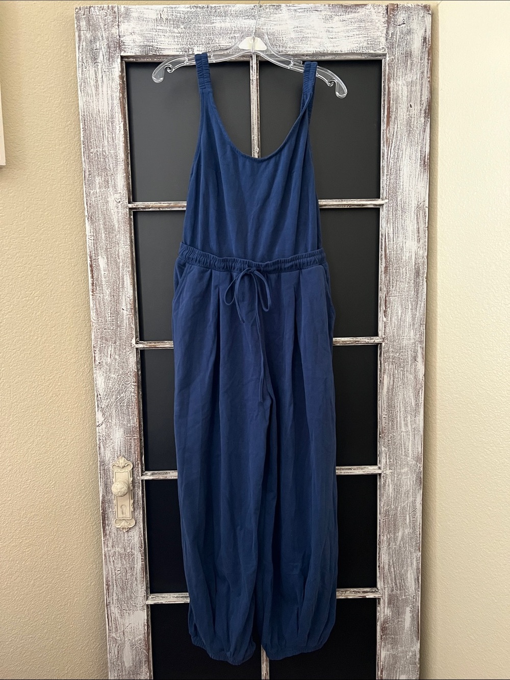 Listicle navy blue sleeveless drawstring Jumpsuit.
